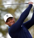 Tiger Woods hits a tee shot on the ninth hole during a practice round for to the Phoenix Open golf tournament on Tuesday, Jan. 27, 2015, in Scottsdale, Ariz. (AP Photo/Rick Scuteri)