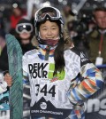 In this Dec. 14, 2013, file photo, Chloe Kim watches the replay of her second run during the snowboarding superpipe final at the Dew Tour iON Mountain Championships in Breckenridge, Colo. Kim took third place in the event. One of the best snowboarders in the world was too young to go to the Sochi Olympics a year ago. So teenager Chloe Kim watched the halfpipe competition from the comfort of her living room while eating popcorn with her family. (AP Photo/Julie Jacobson, File)