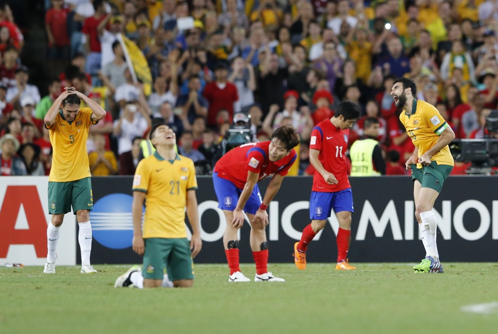 Team Australia celebrates after winning the AFC Asian Cup final soccer match between South Korea and Australia in Sydney, Australia, Saturday, Jan. 31, 2015. (AP Photo/Quentin Jones)