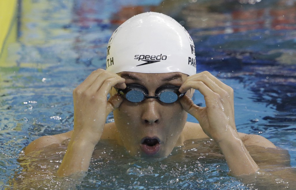 South Korea's Park Tae-hwan adjusts his goggles after competing a men's 200-meter freestyle swimming heat at the 17th Asian Games in Incheon, South Korea, Sunday, Sept. 21, 2014. (AP Photo/Lee Jin-man)