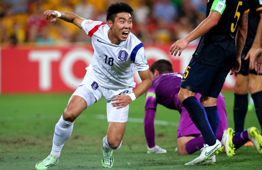 South Korea's Lee Jeonghyeop reacts after scoring his country's first goal during the AFC Asia Cup soccer match between Australia and South Korea in Brisbane, Australia, Saturday, Jan. 17, 2015. (AP Photo/Tertius Pickard)