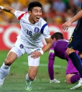 South Korea's Lee Jeong-hyeop reacts after scoring his country's first goal during the AFC Asia Cup soccer match between Australia and South Korea in Brisbane, Australia, Saturday, Jan. 17, 2015. (AP Photo/Tertius Pickard)