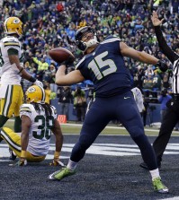 Seattle Seahawks' Jermaine Kearse celebrates after catching the game-winning touchdown during overtime of the NFL football NFC Championship game against the Green Bay Packers Sunday, Jan. 18, 2015, in Seattle. The Seahawks won 28-22 to advance to Super Bowl XLIX. (AP Photo/Jeff Chiu)