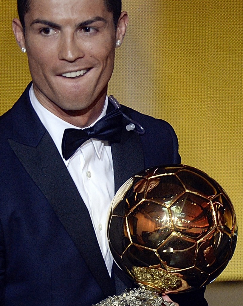 Cristiano Ronaldo of Portugal reacts after winning the FIFA Men's soccer player of the year 2014 prize at the FIFA Ballon d'Or awarding ceremony at the Kongresshaus in Zurich, Switzerland, Monday,  Jan. 12, 2015. ( AP Photo/KEYSTONE,Walter Bieri)