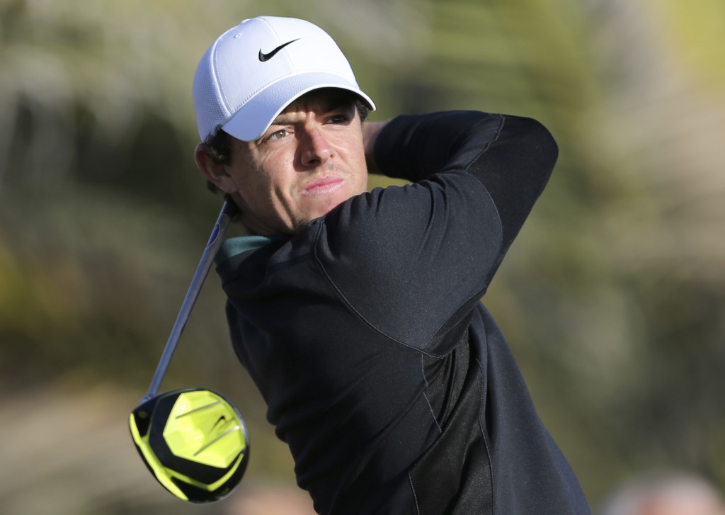 Rory McIlroy of Northern Ireland tees off on the 14th hole during first round of the Abu Dhabi HSBC Golf Championship in Abu Dhabi, United Arab Emirates, Thursday Jan. 15, 2015. (AP Photo/Kamran Jebreili)