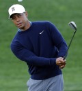 Tiger Woods hits out of the bunker on the ninth hole at the Phoenix Open. (AP Photo/Rick Scuteri)