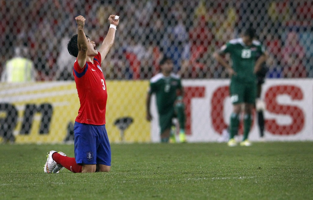 South Korea's Kim Jin Su, celebrates after the AFC Asian Cup semifinal soccer match between South Korea and Iraq in Sydney, Australia, Monday, Jan. 26, 2015. (AP Photo/Quentin Jones)