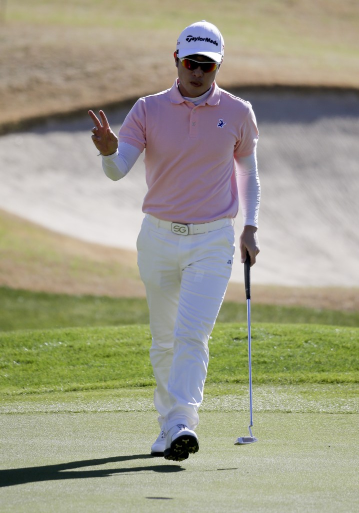 Sung Joon Park, of South Korea, waves after saving par on the first hole during the final round of the Humana Challenge golf tournament on the Palmer Private course at PGA West on Sunday, Jan. 25, 2015 in La Quinta, Calif. (AP Photo/Chris Carlson)