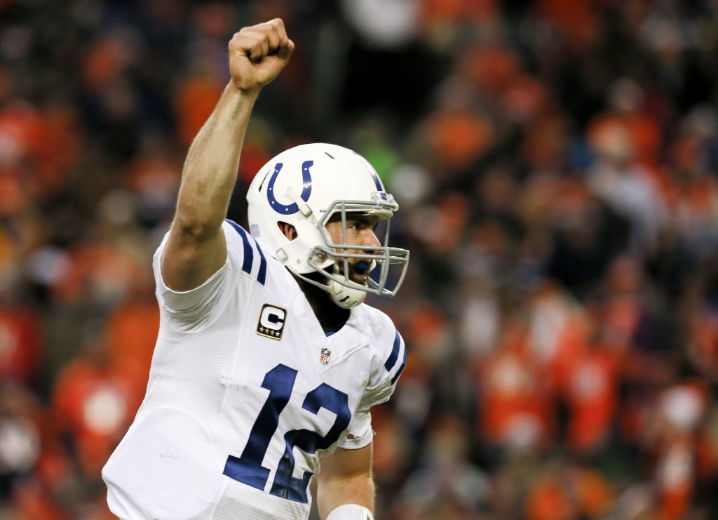 Indianapolis Colts quarterback Andrew Luck celebrates a touchdown pass against the Denver Broncos during the second half of an NFL divisional playoff football game, Sunday, Jan. 11, 2015, in Denver. (AP Photo/Joe Mahoney)