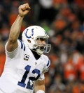 Indianapolis Colts quarterback Andrew Luck celebrates a touchdown pass against the Denver Broncos during the second half of an NFL divisional playoff football game, Sunday, Jan. 11, 2015, in Denver. (AP Photo/Joe Mahoney)