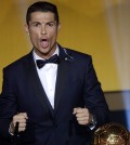 Cristiano Ronaldo of Portugal reacts after winning the FIFA Men's soccer player of the year 2014 prize at the FIFA Ballon d'Or awarding ceremony at the Kongresshaus in Zurich, Switzerland, Monday,  Jan. 12, 2015. ( AP Photo/(KEYSTONE,Walter Bieri)