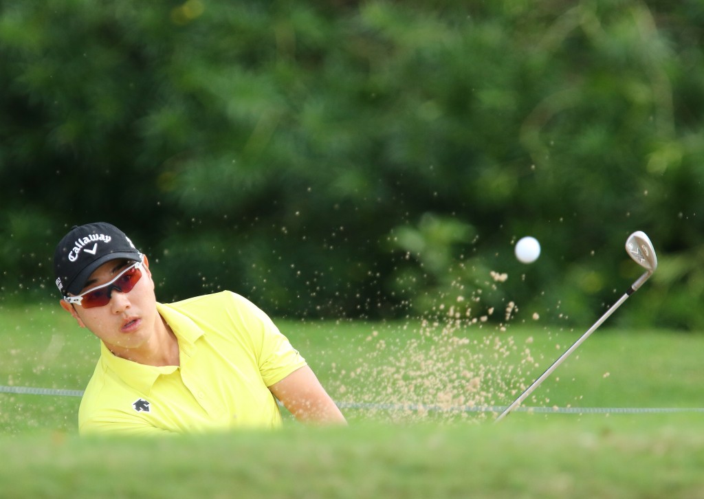 Bae Sang-Moon from South Korea hits out of the bunker on the eighth hole during the first round of the Sony Open golf tournament, Thursday, Jan, 15, 2015, in Honolulu, Hawaii. (AP Photo/Hugh Gentry)