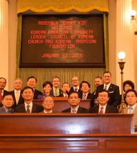Assemblywoman Young Kim and Korean American organization members celebrate a unanimous committee vote for the Korean American Day bill Monday.