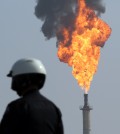 A very large smokestack flare burns off flammable product after an explosion in a processing facility at the ExxonMobil refinery in Torrance, Calif. on Wednesday, Feb. 18, 2015. A small ground fire was quickly extinguished and the facility's flare system was triggered for safety reasons. Two workers suffered minor injuries. (AP Photo/Daily Breeze, Chuck Bennett)