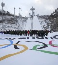 Participants attend an event marking the three-year countdown to the start of the 2018 Winter Olympics at Alpensia Ski Jumping Centre in Pyeongchang, South Korea, Monday, Feb. 9, 2015. The South Korean government recently rejected a proposal by the International Olympic Committee to halt construction on a new bobsled, luge and skeleton venue and relocate the events to an existing sliding center in another country. The IOC said the move would have saved $120 million in construction costs and $3.5 million in yearly maintenance fees.(AP Photo/Yonhap, Han Jong-chan)