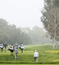 The grouping of Carlos Ortiz, left, and Erik Compton, center, and James Hahn, right, walk down the fairway after teeing off on the 12th hole during the first round of the Northern Trust Open golf tournament at Riviera Country Club in the Pacific Palisades area of Los Angeles on Thursday, Feb. 19, 2015. (AP Photo/Danny Moloshok)