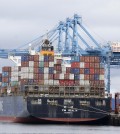 A cargo container ship operated by Yang Ming Marine Transport Corp. sits docked at the Port of Tacoma, Friday, Feb. 20, 2015, in Tacoma, Wash. With a Friday deadline looming, negotiators for the two sides in the contract dispute that has snarled international trade at U.S. West Coast seaports are laboring to reach a settlement as billions of dollars of cargo are sitting massive ocean-going ships anchored outside port facilities. (AP Photo/Ted S. Warren)