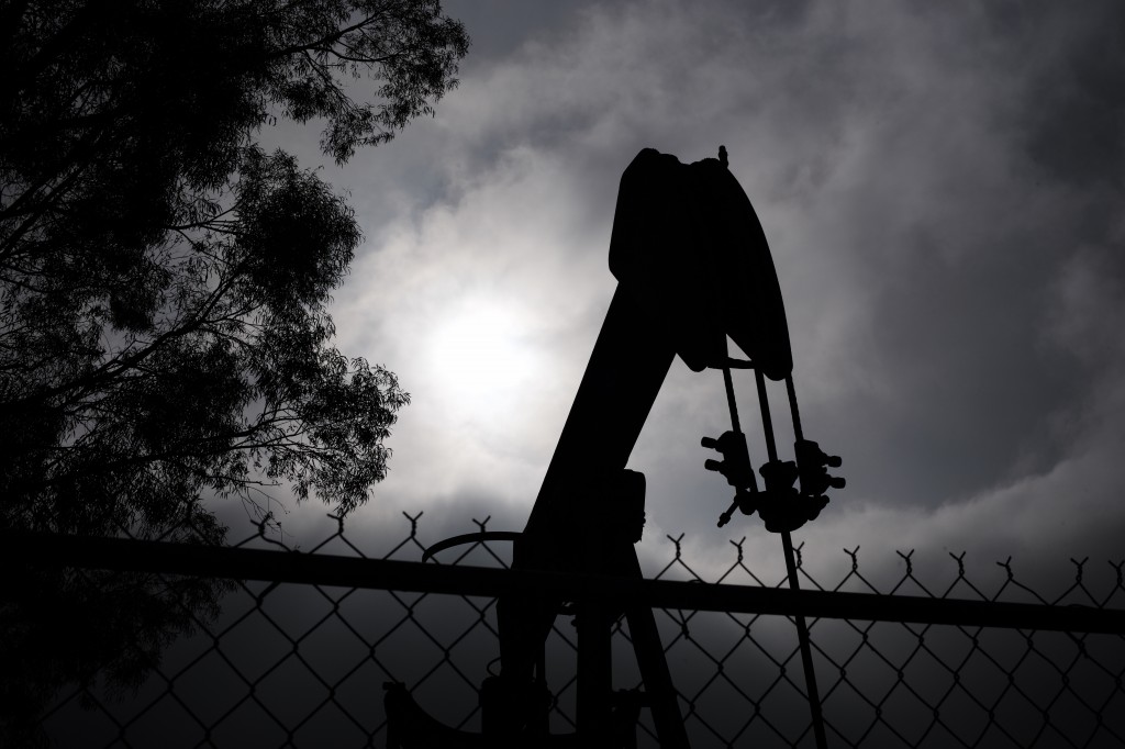 A pumpjack operates next to Tony Lemon's home, Thursday, Jan. 15, 2015, in Bakersfield, Calif. Lemon and other neighbors living around the idled well said they had been told nothing of any threat to local water. But Lemon said he trusted oil companies to safeguard the public water supply. As long as they know what theyre doing, taking care of business, Lemon said. (AP Photo/Jae C. Hong)