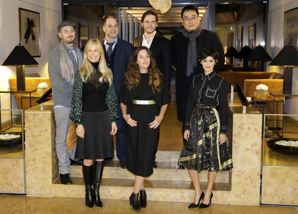 The members of the Jury of the 65th International Film Festival Berlinale, back row frrom left, President Darren Aronofsky, Matthew Weiner, Daniel Bruehl, Bong Joon-ho, front row from left,  Martha De Laurentiis, Claudia Llosa and Audrey Tautou, pose for a photo prior to the Jury's Dinner on the eve of the opening of the festival in Berlin, Germany, Wednesday, Feb. 4, 2015. (AP Photo/Michael Sohn)
