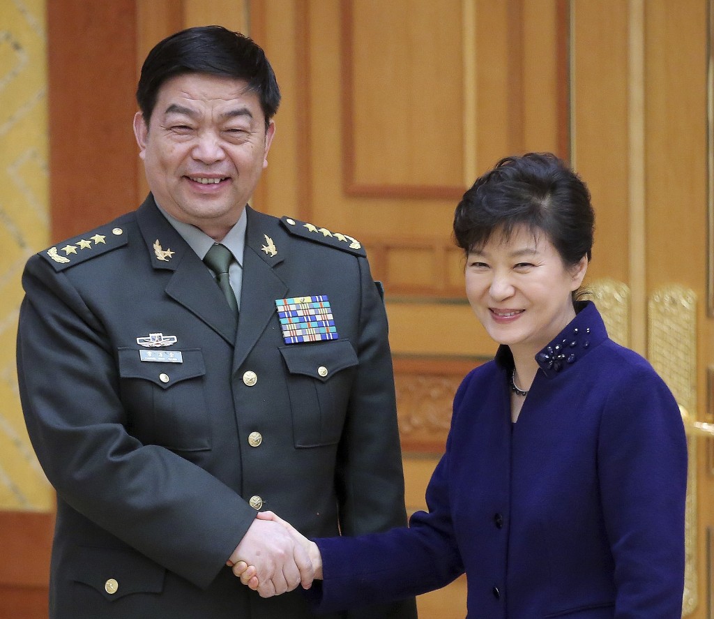 South Korean President Park Geun-hye, right, shakes hands with Chinese Defense Minister Chang Wanquan during a meeting at the presidential house in Seoul, South Korea, Wednesday, Feb. 4, 2015. Chang arrived in Seoul on Tuesday for talks with South Korean officials on North Korea's nuclear program and ways to boost bilateral military ties. (AP Photo/Yonhap, Lee Jung-hoon)