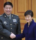 South Korean President Park Geun-hye, right, shakes hands with Chinese Defense Minister Chang Wanquan during a meeting at the presidential house in Seoul, South Korea, Wednesday, Feb. 4, 2015. Chang arrived in Seoul on Tuesday for talks with South Korean officials on North Korea's nuclear program and ways to boost bilateral military ties. (AP Photo/Yonhap, Lee Jung-hoon)