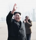 North Korean leader Kim Jong-un waves to construction workers at an event in Pyongyang in this photo released by KCNA on Feb. 12, 2015. (No sale outside of South Korea) (KCNA-Yonhap)