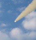 This Rodong Sinmun photo released on June 27, 2014, shows the test-fire of the North's newly developed tactical guided missiles. (Yonhap)