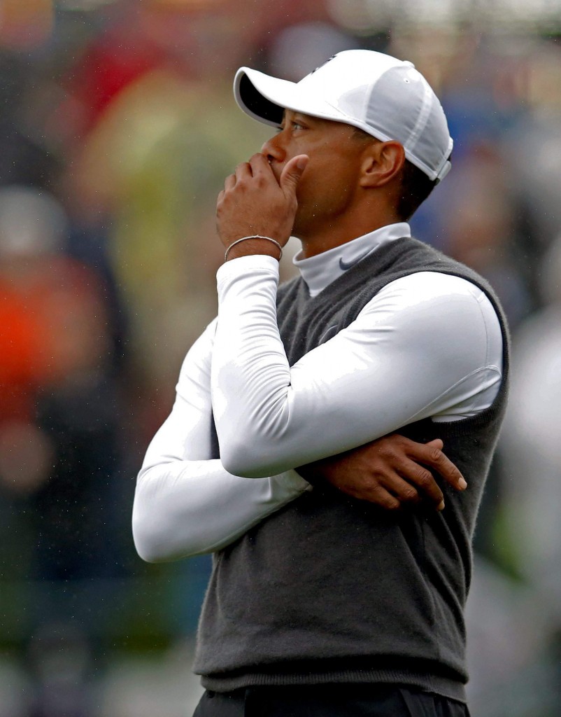 Tigers Woods reacts after missing a putt on the fourth hole during the second round of the Phoenix Open golf tournament, Friday, Jan. 30, 2015, in Scottsdale, Ariz. (AP Photo/Rick Scuteri)