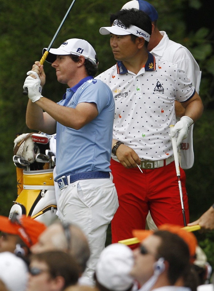 Y. E. Yang, of South Korea, looks on at right as Rory McIlroy, of Northern Ireland, hits his shot. Yang is not even on the PGA Tour anymore. (AP)