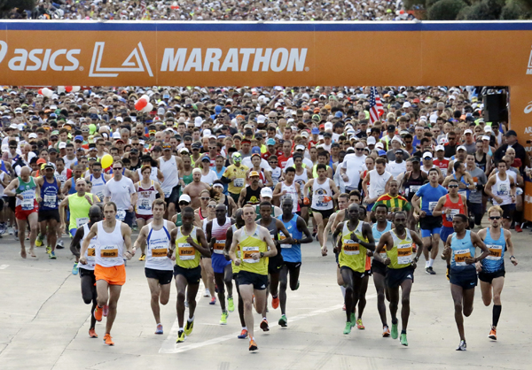 Runners take off from Dodger Stadium during the Los Angeles Marathon in Los Angeles, Sunday, March 9, 2014.  (AP Photo/Reed Saxon)