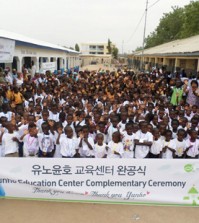 Students and local residents celebrate the opening of "Yunho Education Center," a school named after K-pop singer U-Know Yunho, in Bongo, northern Ghana, on Feb. 20. (Courtesy of Food for the Hungry)