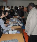 JABI Charity Association volunteers hand out underwear sets to the homeless at Cityteam.