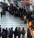 Jobseekers wait in line for an interview at the Busan Exhibition and Convention Center (BEXCO) in this 2013 file photo. Seventy-four companies took part in the job fair to hire 510 job applicants. (Korea Times file)