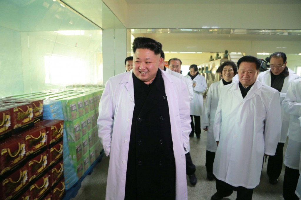 North Korean leader Kim Jong-un (L) tours a foodstuff factory in Pyongyang. North Korea's official Korean Central News Agency reported it on Jan. 19, 2015, without elaborating on the timing of the visit. (KCNA-Yonhap)