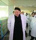 North Korean leader Kim Jong-un (L) tours a foodstuff factory in Pyongyang. North Korea's official Korean Central News Agency reported it on Jan. 19, 2015, without elaborating on the timing of the visit. (KCNA-Yonhap)