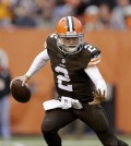 FILE - In this Sunday, Dec. 14, 2014, file photo, Cleveland Browns quarterback Johnny Manziel scrambles against the Cincinnati Bengals during an NFL football game, in Cleveland. An advisor for Manziel said in a statement released by the team Monday, Feb. 2, 2015, that Manziel has decided to enter treatment for an unspecified condition. (AP Photo/Tony Dejak, File)