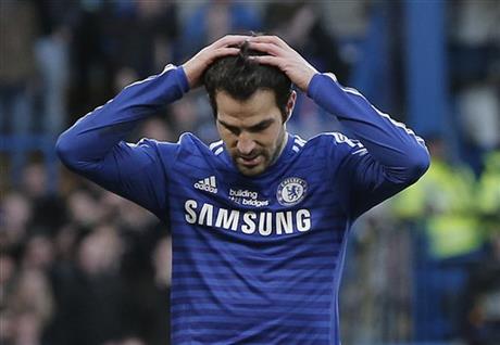 Chelsea's Cesc Fabregas reacts after missing a chance to score against Burnley during an English Premier League soccer match at the Stamford Bridge ground in London, Saturday, Feb. 21, 2015. The match ended 1-1 draw. (AP Photo/Lefteris Pitarakis)