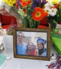 A makeshift memorial appears on display, Wednesday, Feb. 11, 2015, at the University of North Carolina School of Dentistry in Chapel Hill, N.C., in remembrance of Deah Shaddy Barakat, 23, Yusor Mohammad, 21, and Razan Mohammad Abu-Salha, 19, who were killed on Tuesday. Craig Stephen Hicks, 46, has been charged with three counts of first-degree murder in the case. (AP Photo/The News & Observer, Chris Seward)