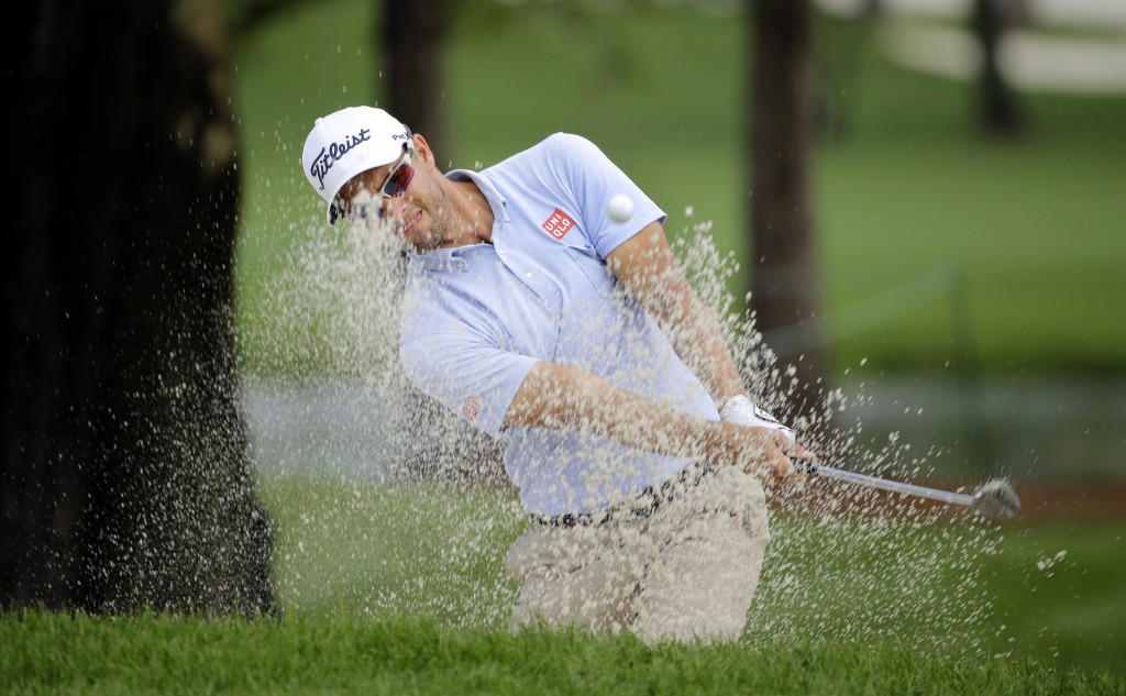 Adam Scott, of Australia, hits out of the sand on the 16th hole during the first round of the Valspar Championship golf tournament, Thursday, March 12, 2015, at Innisbrook in Palm Harbor, Fla. (AP Photo/Chris O'Meara)