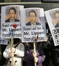 South Korean conservative activists hold portraits of U.S. Ambassador to South Korea Mark Lippert during a rally demanding his  speedy recovery near the U.S. embassy in Seoul, South Korea, Friday, March 6, 2015. A knife attack Thursday that injured Lippert is the latest act of political violence in a deeply divided country where some protesters portray their causes as matters of life and death.  The letters read " We love U.S. Ambassador to South Korea Mark Lippert  and demand the alliance between South Korea and the United States" (AP Photo/Ahn Young-joon)