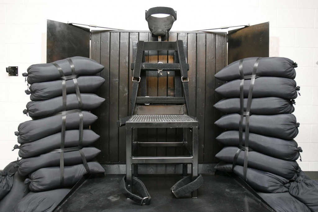 FILE - This June 18, 2010, file photo shows the firing squad execution chamber at the Utah State Prison in Draper, Utah. Utah's Gov. Gary Herbert will not say if he'll sign a bill to bring back the firing squad but does say the method would give Utah a backup execution method. Herbert's spokesman Marty Carpenter issued a statement about the bill Tuesday in response to questions from reporters. Utah's Senate is set to cast a final vote on the bill this week. It would call for a firing squad if lethal injection drugs cannot be obtained 30 days before an execution. (AP Photo/Trent Nelson, Pool, File)