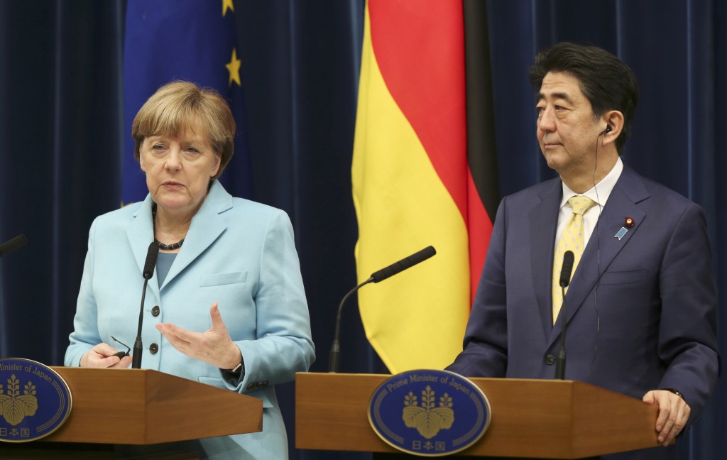 Germany's Chancellor Angela Merkel speaks during a joint press conference with Japanese Prime Minister Shinzo Abe at Prime Minister's official Residence in Tokyo, Monday, March 9, 2015. (AP Photo/Koji Sasahara)