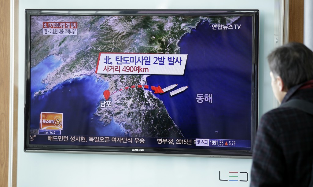 A man watches a TV news program reporting on North Korea fired two short-range ballistic missiles into the sea two short-range ballistic missiles into the sea, at Seoul Railway Station in Seoul, South Korea, Monday, March 2, 2015. North Korea on Monday fired two short-range ballistic missiles into the sea and warned of "merciless strikes" against its enemies as allies Seoul and Washington launched annual military drills Pyongyang claims are preparation for a northward invasion. The letters read "North Korea, fired two short-range ballistic missiles." (AP Photo/Lee Jin-man)