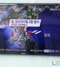 A man watches a TV news program reporting on North Korea fired two short-range ballistic missiles into the sea two short-range ballistic missiles into the sea, at Seoul Railway Station in Seoul, South Korea, Monday, March 2, 2015. North Korea on Monday fired two short-range ballistic missiles into the sea and warned of "merciless strikes" against its enemies as allies Seoul and Washington launched annual military drills Pyongyang claims are preparation for a northward invasion. The letters read "North Korea, fired two short-range ballistic missiles." (AP Photo/Lee Jin-man)