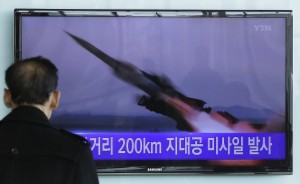 A South Korean man watches a TV news program showing the file footage of the missile launch conducted by North Korea, at Seoul Railway Station in Seoul, South Korea, Friday, March 13, 2015. North Korea has test fired seven short-range missiles into the sea, South Korean officials said Friday, in the latest such tests launched during ongoing South Korea-U.S. military drills.The writing on the screen reads " Launched 200 kilometers missile " (AP Photo/Ahn Young-joon)