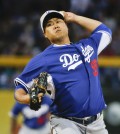 Los Angeles Dodgers starting pitcher Hyun-Jin Ryu throws against the San Diego Padres during a spring training baseball game Thursday, March 12, 2015, in Peoria, Ariz.  (AP Photo/Lenny Ignelzi)