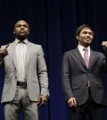 Floyd Mayweather Jr., left, and Manny Pacquiao, of the Philippines, pose for photos during a news conference, Wednesday, March 11, 2015, in Los Angeles. The two are scheduled to fight in Las Vegas on May 2. (AP Photo/Jae C. Hong)