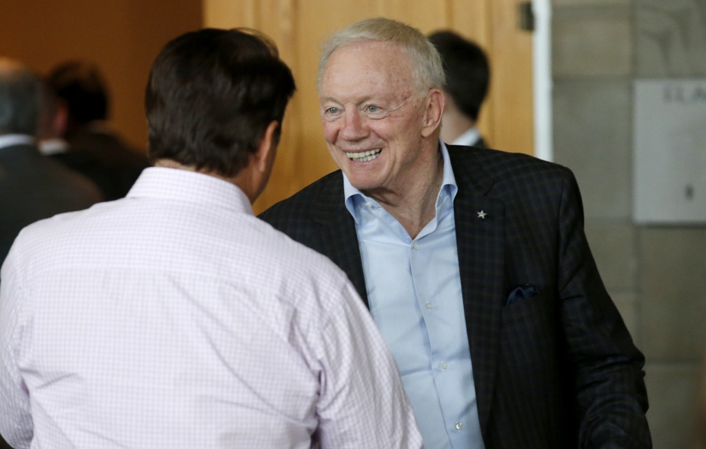 Dallas Cowboys owner Jerry Jones smiles as he is greeted as he arrives to attend a general session at the NFL Annual Meeting Monday, March 23, 2015, in Phoenix. (AP Photo/Ross D. Franklin)