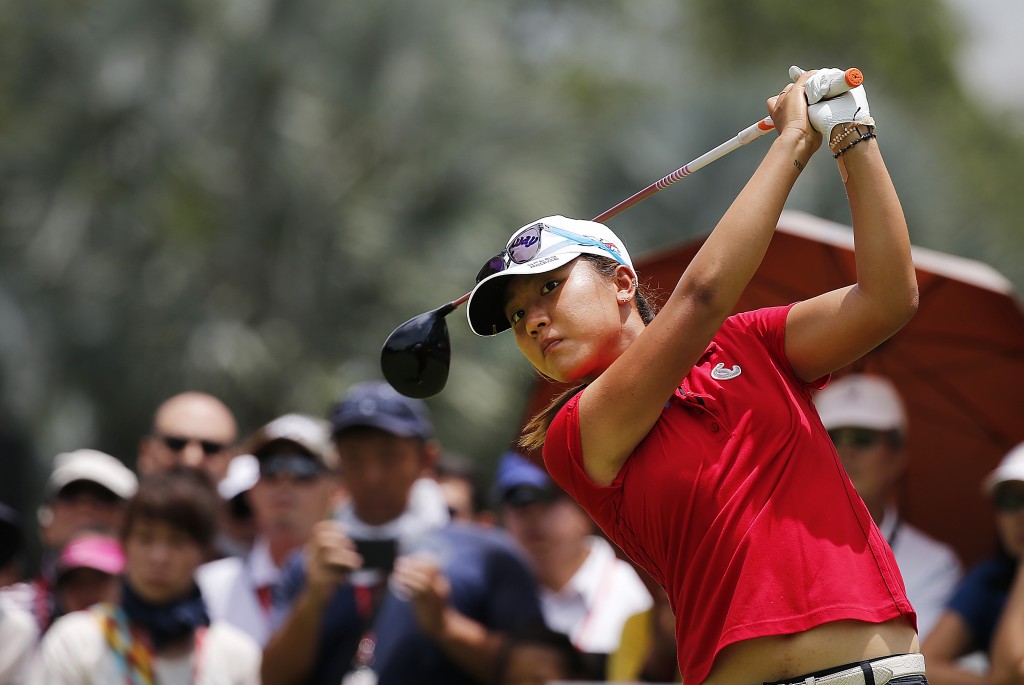 Lydia Ko of New Zealand tees off on the 11th hole during the final round of the HSBC Women's Champions golf tournament on Sunday, March 8, 2015 in Singapore. (AP Photo/Wong Maye-E)