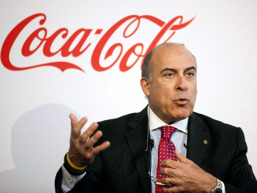 Coca-Cola CEO Muhtar Kent speaks during a news conference in Atlanta. Coca-Cola is revising its pay plan for executives after shareholders including Warren Buffett expressed disapproval and called it excessive. (AP Photo/David Goldman/0